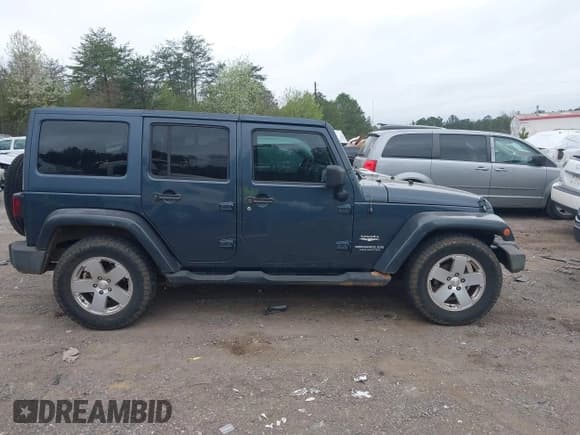 ✅ 2007 Jeep Wrangler Unlimited Sahara • VIN: 1J4GB59197L200251 • Lot: 41801513. Listed on IAAI with 200,612 mi. Free auction sales archive from the USA and detailed vehicle history report at DreamBid. Image 13.