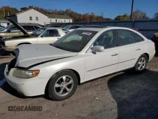 2006 Hyundai Azera SE z VIN KMHFC46FX6A136882, wystawiony jako Copart lot #77377864 z przebiegiem 165 124 mil mil oraz Szkoda całkowita • Salvage title. Historia ofert i sprzedaży dostępna na DreamBid. Obrazek 1.