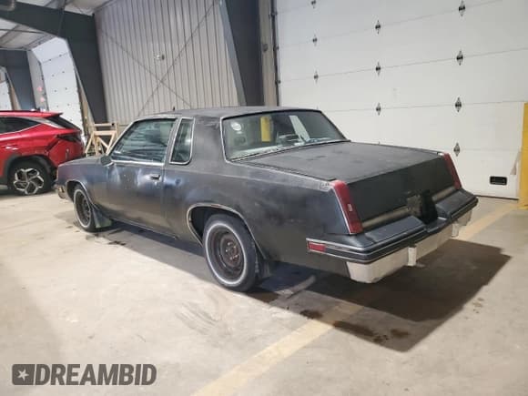 ✅ 1987 Oldsmobile Cutlass Supreme • VIN: 1G3GR11A7HP303457 • Lot: 64872645. Listed on Copart with 55,863 mi. Free auction sales archive from the USA and detailed vehicle history report at DreamBid. Image 2.