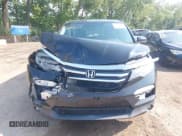 ✅ 2017 Honda Pilot EX-L • VIN: 5FNYF6H57HB032784 • Lot: 42893011. Listed on IAAI with 125,407 mi. Free auction sales archive from the USA and detailed vehicle history report at DreamBid. Image 12.