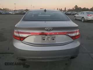 2013 Hyundai Azera с VIN KMHFH4JG7DA203159, выставлен на аукционе Copart как лот 77546384 с пробегом 163 509 миль миль и Списание • Salvage title. История ставок и продаж доступна на DreamBid. Изображение 6.