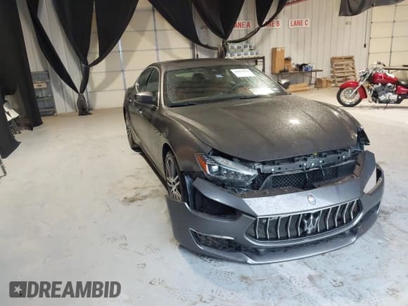 ✅ 2018 Maserati Ghibli S GranLusso • VIN: ZAM57YSL4J1265566 • Лот: 42094312. Опубликован ранее на IAAI с пробегом 25 027 миль. Бесплатный доступ к архиву аукционных продаж из США и подробный отчёт об истории автомобиля на DreamBid. Изображение 1.