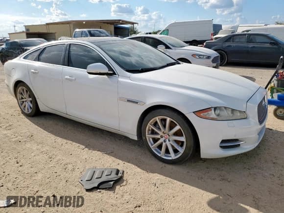 ✅ 2014 Jaguar XJ • VIN: SAJWA1CZ2E8V59275 • Лот: 68568925. Опубликован ранее на Copart с пробегом 74 696 миль. Бесплатный доступ к архиву аукционных продаж из США и подробный отчёт об истории автомобиля на DreamBid. Изображение 4.