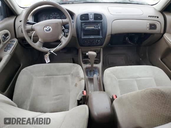 ✅ 2000 Mazda Protege DX • VIN: JM1BJ2223Y0295154 • Lot: 79511954. Wystawiony na Copart z przebiegiem 116 781 mil. Bezpłatny archiwum sprzedaży aukcyjnych z USA i szczegółowy raport historii pojazdu na DreamBid. Zdjęcie 8.