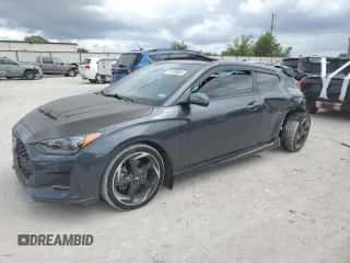 2019 Hyundai Veloster Turbo с VIN KMHTH6AB7KU020617, выставлен на аукционе Copart как лот 71170864 с пробегом 92 290 миль миль и Списание • Salvage title. История ставок и продаж доступна на DreamBid. Изображение 1.