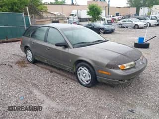 2000 Saturn SW z VIN 1G8ZJ8274YZ132063, wystawiony jako IAAI lot #42453187 z przebiegiem 140 166 mil mil oraz . Historia ofert i sprzedaży dostępna na DreamBid. Obrazek 1.