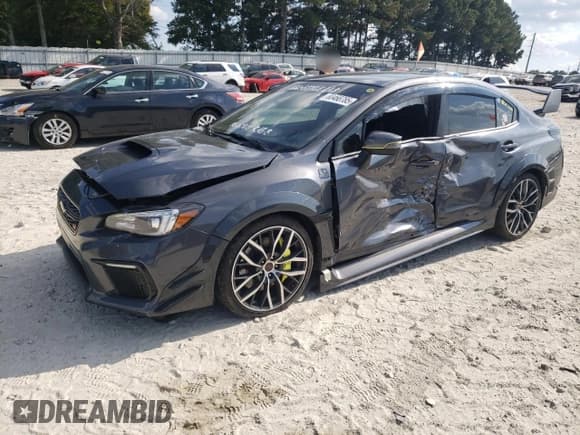✅ 2020 Subaru WRX STI • VIN: JF1VA2E6XL9818692 • Lot: 84190615. Listed on Copart with 60,345 mi. Free auction sales archive from the USA and detailed vehicle history report at DreamBid. Image 1.