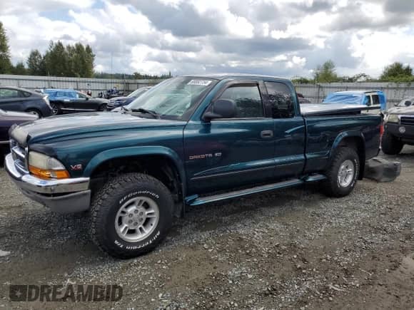 1998 Dodge Dakota SLT z VIN 1B7GG22YXWS639234, wystawiony jako Copart lot #68892734 z przebiegiem 123 588 mil mil oraz Szkoda całkowita • Salvage title. Historia ofert i sprzedaży dostępna na DreamBid. Obrazek 1.