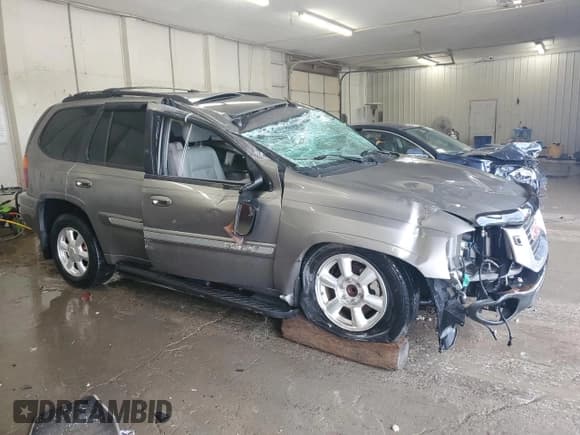 ✅ 2005 GMC Envoy SLT • VIN: 1GKDS13S152270398 • Lot: 56160625. Listed on Copart with 123,260 mi. Free auction sales archive from the USA and detailed vehicle history report at DreamBid. Image 4.