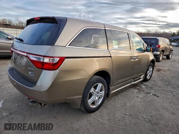 ✅ 2012 Honda Odyssey Touring • VIN: 5FNRL5H95CB004484 • Lot: 96341915. Listed on Copart with 123,591 mi. Free auction sales archive from the USA and detailed vehicle history report at DreamBid. Image 3.