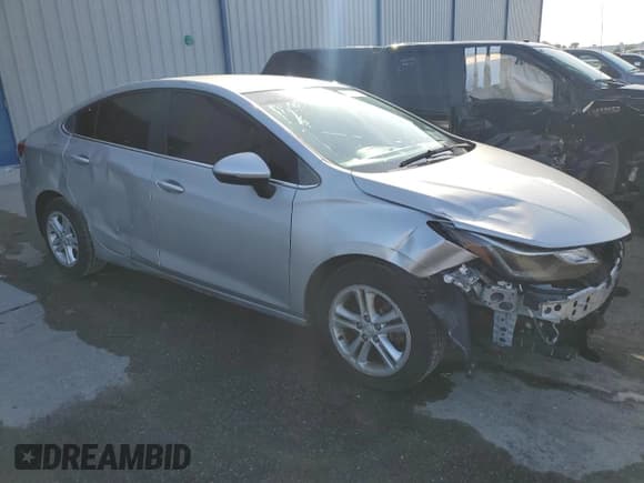 ✅ 2018 Chevrolet Cruze LT • VIN: 1G1BE5SM0J7164843 • Lot: 59765783. Listed on Copart with 65,834 mi. Free auction sales archive from the USA and detailed vehicle history report at DreamBid. Image 4.