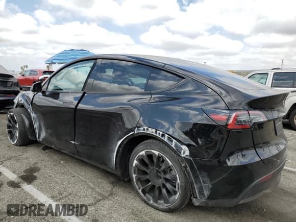 ✅ 2023 Tesla Model Y • VIN: 7SAYGDED1PF941165 • Lot: 71301845. Listed on Copart with 18,142 mi. Free auction sales archive from the USA and detailed vehicle history report at DreamBid. Image 2.