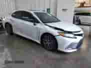 2022 Toyota Camry Hybrid XLE with VIN 4T1F31AK4NU572580, listed as a IAAI auction lot 42244158 with 69,247 mi miles and . Bid and sale history available at DreamBid. Image 6.