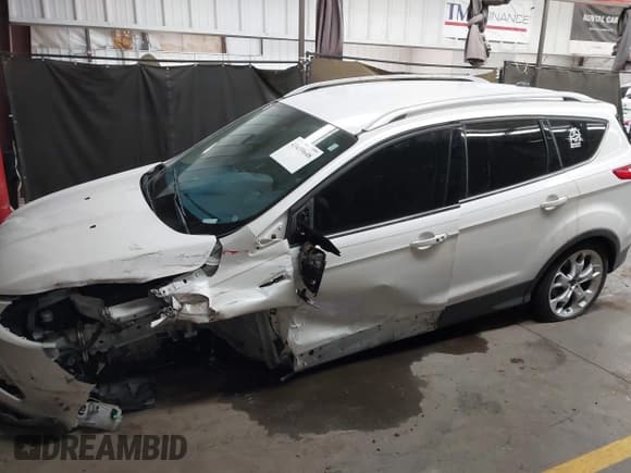 ✅ 2014 Ford Escape Titanium • VIN: 1FMCU0J91EUC22802 • Лот: 43439648. Опубликован ранее на IAAI с пробегом 90 649 миль. Бесплатный доступ к архиву аукционных продаж из США и подробный отчёт об истории автомобиля на DreamBid. Изображение 14.