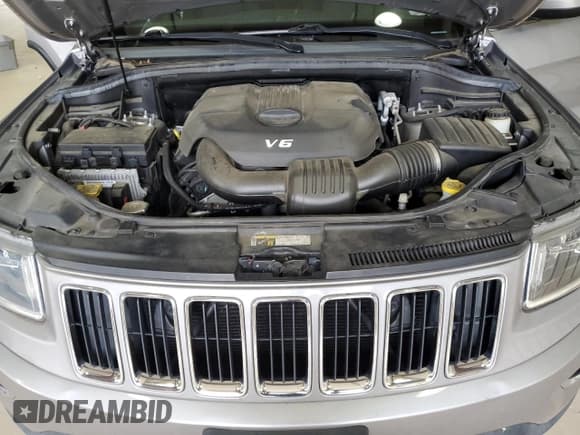 ✅ 2015 Jeep Grand Cherokee Laredo • VIN: 1C4RJFAG0FC834764 • Lot: 82690815. Listed on Copart with 67,519 mi. Free auction sales archive from the USA and detailed vehicle history report at DreamBid. Image 12.