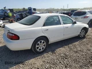 ✅ 2002 Mazda 626 LX • VIN: 1YVGF22CX25295785 • Лот: 53566655. Опубликован ранее на Copart с пробегом 160 739 миль. Бесплатный доступ к архиву аукционных продаж из США и подробный отчёт об истории автомобиля на DreamBid. Изображение 3.