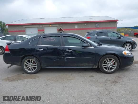 2012 Chevrolet Impala LTZ with VIN 2G1WC5E33C1155824, listed as a IAAI auction lot 43149723 with 148,084 mi miles and . Bid and sale history available at DreamBid. Image 13.