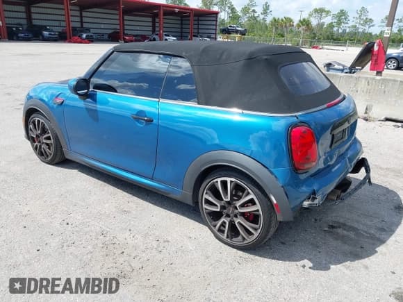 ✅ 2022 MINI Convertible John Cooper Works • VIN: WMW63DL0XN3P15732 • Lot: 41807134. Listed on IAAI with 52,631 mi. Free auction sales archive from the USA and detailed vehicle history report at DreamBid. Image 3.