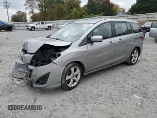 ✅ 2012 Mazda 5 Grand Touring • VIN: JM1CW2DL4C0143713 • Lot: 91699415. Wystawiony na Copart z przebiegiem 124 548 mil. Bezpłatny archiwum sprzedaży aukcyjnych z USA i szczegółowy raport historii pojazdu na DreamBid. Zdjęcie 1.