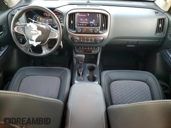 ✅ 2020 Chevrolet Colorado 2WD Z71 • VIN: 1GCGSDEN4L1135341 • Лот: 77398214. Опубликован ранее на Copart с пробегом 57 079 миль. Бесплатный доступ к архиву аукционных продаж из США и подробный отчёт об истории автомобиля на DreamBid. Изображение 8.