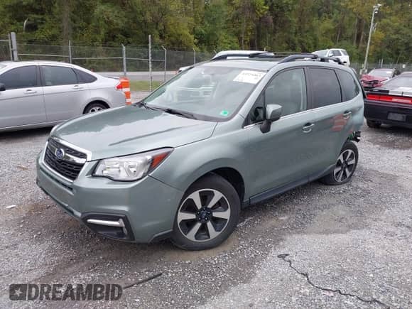 2018 Subaru Forester Limited with VIN JF2SJAJC7JH599214, listed as a IAAI auction lot 43324463 with 87,024 mi miles and . Bid and sale history available at DreamBid. Image 2.