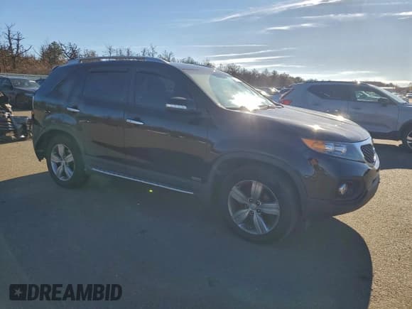✅ 2013 Kia Sorento EX • VIN: 5XYKUDA6XDG371058 • Lot: 94140285. Listed on Copart with 113,512 mi. Free auction sales archive from the USA and detailed vehicle history report at DreamBid. Image 4.
