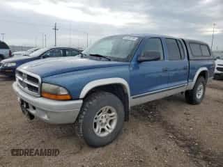 2004 Dodge Dakota SLT z VIN 1D7HG48N04S695750, wystawiony jako Copart lot #61059154 z przebiegiem Nie podano mil oraz Szkoda całkowita • Salvage title. Historia ofert i sprzedaży dostępna na DreamBid. Obrazek 1.