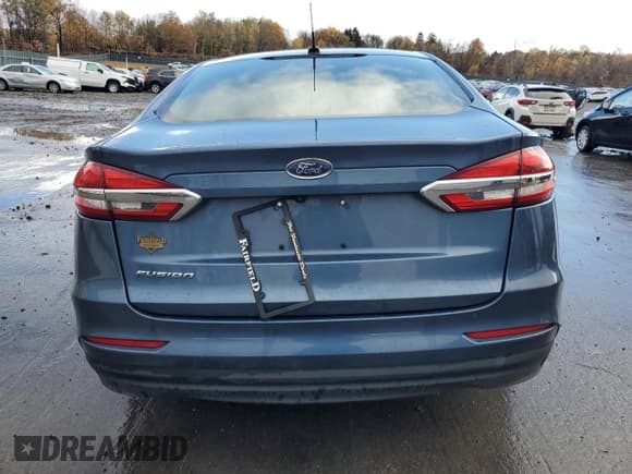 ✅ 2019 Ford Fusion S • VIN: 3FA6P0G77KR129242 • Лот: 90438905. Опубликован ранее на Copart с пробегом 71 785 миль. Бесплатный доступ к архиву аукционных продаж из США и подробный отчёт об истории автомобиля на DreamBid. Изображение 6.