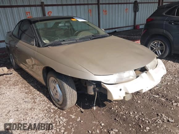 ✅ 1997 Saturn 2dr Coupe • VIN: 1G8ZH127XVZ333643 • Лот: 42463504. Опубликован ранее на IAAI с пробегом 104 295 миль. Бесплатный доступ к архиву аукционных продаж из США и подробный отчёт об истории автомобиля на DreamBid. Изображение 1.