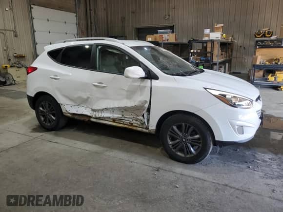 2014 Hyundai Tucson Limited with VIN KM8JUCAG2EU806309, listed as a Copart auction lot 66015735 with 104,328 mi miles and Salvage title. Bid and sale history available at DreamBid. Image 4.