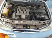 ✅ 1998 Ford Contour LX • VIN: 1FAFP66LXWK197384 • Lot: 51519385. Listed on Copart with 56,958 mi. Free auction sales archive from the USA and detailed vehicle history report at DreamBid. Image 11.