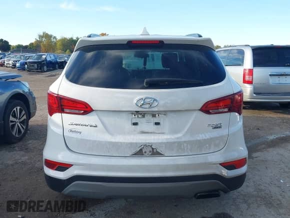2018 Hyundai Santa Fe 2.4L z VIN 5NMZUDLB1JH097002, wystawiony jako IAAI lot #43473652 z przebiegiem 182 069 mil mil oraz . Historia ofert i sprzedaży dostępna na DreamBid. Obrazek 17.