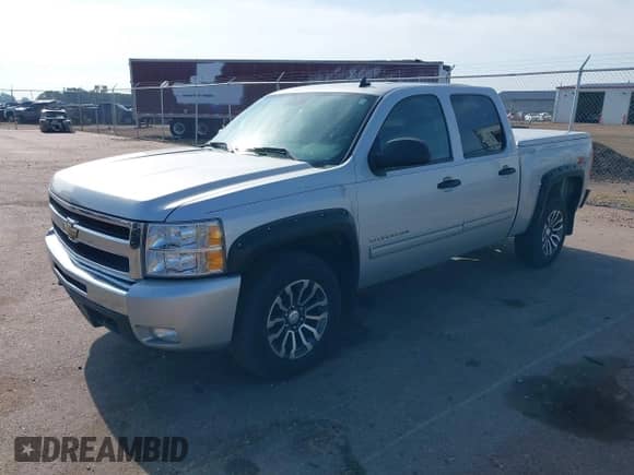 2011 Chevrolet Silverado 1500 LT with VIN 3GCPKSE38BG219794, listed as a IAAI auction lot 42793119 with 131,453 mi miles and . Bid and sale history available at DreamBid. Image 2.