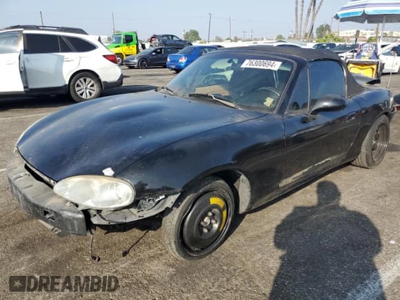 ✅ 2002 Mazda MX-5 Miata Cloth • VIN: JM1NB353220220568 • Lot: 76300694. Listed on Copart with 184,599 mi. Free auction sales archive from the USA and detailed vehicle history report at DreamBid. Image 1.