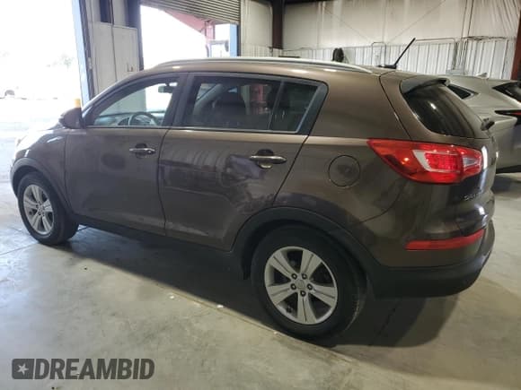 ✅ 2013 Kia Sportage LX • VIN: KNDPBCA23D7451818 • Lot: 64057655. Listed on Copart with 95,572 mi. Free auction sales archive from the USA and detailed vehicle history report at DreamBid. Image 2.