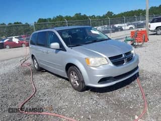 2012 Dodge Grand Caravan SXT z VIN 2C4RDGCG3CR196667, wystawiony jako IAAI lot #43337805 z przebiegiem 167 558 mil mil oraz . Historia ofert i sprzedaży dostępna na DreamBid. Obrazek 1.