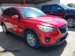 ✅ 2015 Mazda CX-5 Touring • VIN: JM3KE2CY2F0510101 • Lot: 43273950. Listed on IAAI with 128,283 mi. Free auction sales archive from the USA and detailed vehicle history report at DreamBid. Image 1.