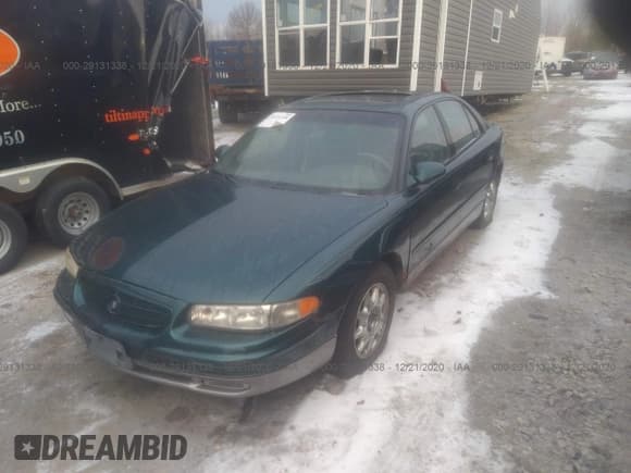 ✅ 1999 Buick Regal GS • VIN: 2G4WF5211X1632883 • Lot: 33933409. Listed on IAAI with 271,039 mi. Free auction sales archive from the USA and detailed vehicle history report at DreamBid. Image 2.