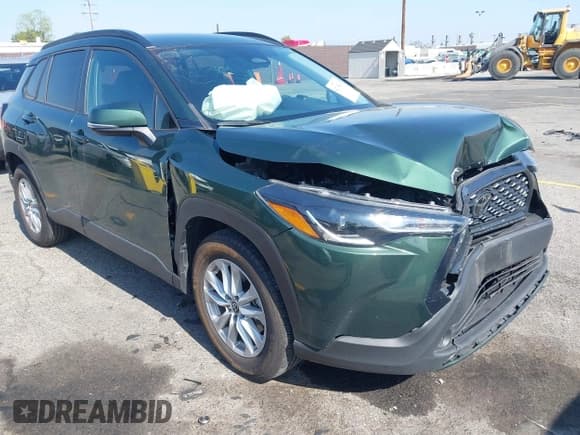 ✅ 2023 Toyota Corolla Cross LE • VIN: 7MUCAAAG3PV042624 • Lot: 42185430. Listed on IAAI with 28,039 mi. Free auction sales archive from the USA and detailed vehicle history report at DreamBid. Image 1.