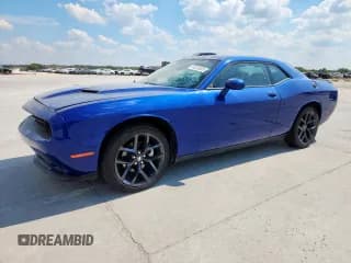 ✅ 2022 Dodge Challenger SXT • VIN: 2C3CDZAG8NH144145 • Lot: 84024325. Wystawiony na Copart z przebiegiem 52 083 mil. Bezpłatny archiwum sprzedaży aukcyjnych z USA i szczegółowy raport historii pojazdu na DreamBid. Zdjęcie 1.
