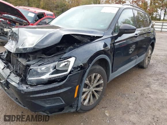 ✅ 2020 Volkswagen Tiguan S • VIN: 3VV1B7AX0LM082124 • Лот: 43534001. Опубликован ранее на IAAI с пробегом 101 006 миль. Бесплатный доступ к архиву аукционных продаж из США и подробный отчёт об истории автомобиля на DreamBid. Изображение 2.