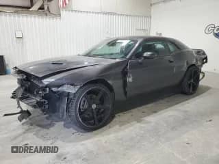 2021 Dodge Challenger SXT z VIN 2C3CDZGG9MH505694, wystawiony jako Copart lot #80821565 z przebiegiem 141 224 mil mil oraz Czysty tytuł • Clean title. Historia ofert i sprzedaży dostępna na DreamBid. Obrazek 1.