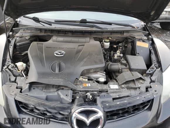 ✅ 2011 Mazda CX-7 S Grand Touring • VIN: JM3ER4DL4B0401021 • Лот: 85787334. Опубликован ранее на Copart с пробегом 161 250 миль. Бесплатный доступ к архиву аукционных продаж из США и подробный отчёт об истории автомобиля на DreamBid. Изображение 11.