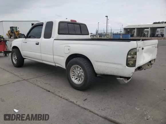 ✅ 1999 Toyota Tacoma • VIN: 4TAVL52N2XZ501492 • Lot: 81868195. Listed on Copart with 288,183 mi. Free auction sales archive from the USA and detailed vehicle history report at DreamBid. Image 2.