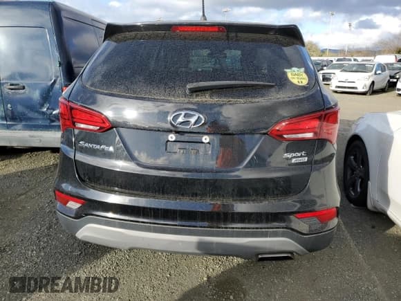✅ 2018 Hyundai Santa Fe 2.4L • VIN: 5XYZTDLB5JG548669 • Лот: 40920463. Опубликован ранее на Copart с пробегом 82 354 миль. Бесплатный доступ к архиву аукционных продаж из США и подробный отчёт об истории автомобиля на DreamBid. Изображение 6.