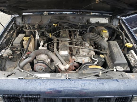 ✅ 1997 Jeep Cherokee Country • VIN: 1J4FJ78S4VL589852 • Lot: 56294015. Listed on Copart with 189,530 mi. Free auction sales archive from the USA and detailed vehicle history report at DreamBid. Image 12.