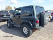 ✅ 2002 Jeep Wrangler Sahara • VIN: 1J4FA59S62P756767 • Lot: 43730556. Listed on IAAI with 145,681 mi. Free auction sales archive from the USA and detailed vehicle history report at DreamBid. Image 3.