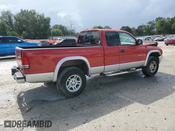 2002 Dodge Dakota SLT with VIN 1B7GG42N42S675772, listed as a Copart auction lot 60318045 with 110,698 mi miles and Salvage title. Bid and sale history available at DreamBid. Image 3.