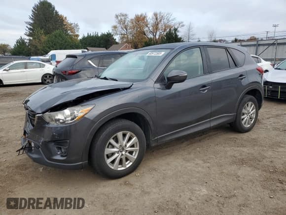 ✅ 2016 Mazda CX-5 Touring • VIN: JM3KE4CYXG0787043 • Lot: 90972585. Wystawiony na Copart z przebiegiem 99 074 mil. Bezpłatny archiwum sprzedaży aukcyjnych z USA i szczegółowy raport historii pojazdu na DreamBid. Zdjęcie 1.