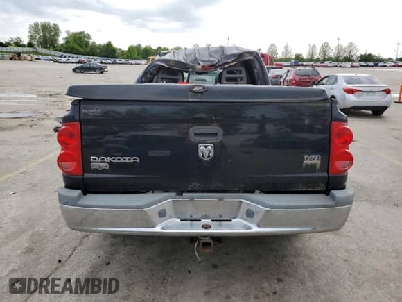 2005 Dodge Dakota Laramie с VIN 1D7HE58N55S214257, выставлен на аукционе Copart как лот 56418875 с пробегом 228 767 миль миль и Списание • Salvage title. История ставок и продаж доступна на DreamBid. Изображение 6.